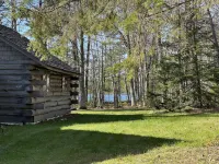 New!  Sleeps 15 Level lawn to lake.  Sandy beach.  Two docks. Great fishing.