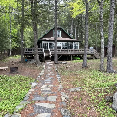 Cozy  Sebec Lake front cabin with dock and fire pit