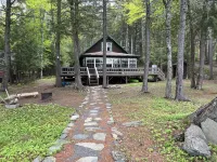 Cozy  Sebec Lake front cabin with dock and fire pit