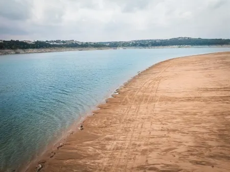 Enjoy lake views from 2 decks! Walk to pool, gym & golf course. Lake access.