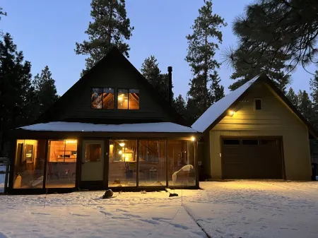 Wooden A-Frame Cabin Nestled in the Tall Pines
