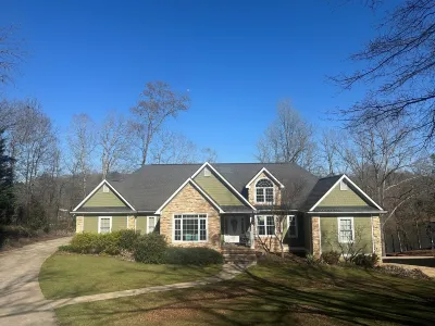 Beautiful lakefront home on over an acre with lots of room, views, and amenities
