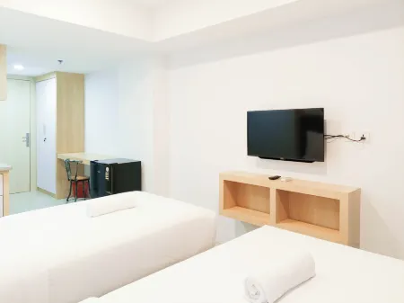 Cozy Studio Room at de Prima Apartment Отели в г. Sei Putih Tengah