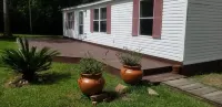 Clean and Cozy Creekside Home Hotels near Mims Baptist Church