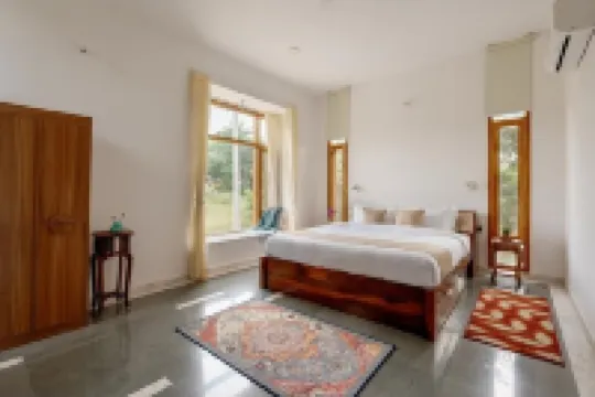 Two-bedroom boutique homestay with a serene view of Lake Lakhawali and Aravalis.