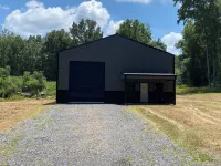 TAKE IT EASY Fishing Cabin. Large enclosed bay for storing the boat.