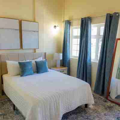 2-bedroom Gated Oasis with parking andPool Rooms