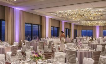 a large dining room filled with tables and chairs , ready for a formal event or a wedding reception at Grand Hyatt Denver
