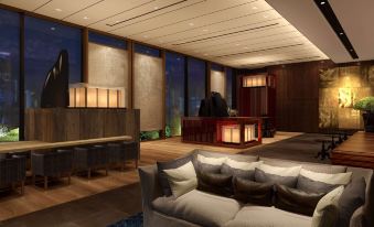The large room in the living area is furnished with oriental-style windows and furniture at Hyatt Centric Kanazawa