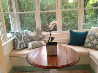 Romantic, cozy cottage nestled amongst live oaks & palms, a block from beach.