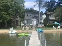 Experience Lake Life at Our 3-Bedroom Beachfront Cottage, Near Grand Rapids.