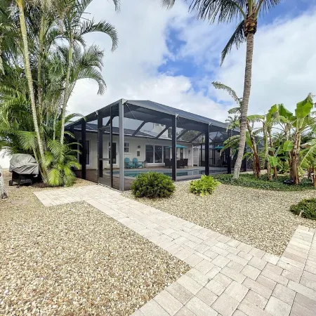 Cute canal front Cottage with dock & boat lift and pool ,short walk to the beach