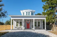 New Luxury heated pool home, steps to the beach with two master suites!