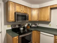 This Two-Bedroom Cottage Features One Queen Bed, Two Twin Beds, and a Sofa Bed.