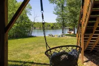 Enchanting 5-Bed/5-Bath Lakefront Log Cabin with Private Cove, Beach & Hot Tub.