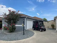 Charming Villa with Screened Lanai and Golf Cart - Cozy Oasis Retreat