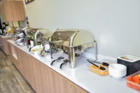 誇烏特莫克坎波門諾温德姆麥客達套房酒店 - 早餐
