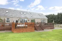 Joivy Greenknowes Lodge with Hot Tub and Wood Burning Stove
