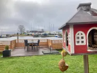 Chalet Gaby with Sauna, Private Dock, and Canoes at Lauwersmeer