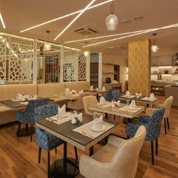 Regenta Inn Grand-ORR, Mahadevapura Отели рядом с достопримечательностью «Торговый центр VR Bengaluru»