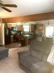 Roomy home with spacious fenced in backyard and fire pit.