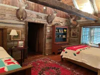 Prospect Mountain Cabin custom log home sportsman's paradise with fishing lake.