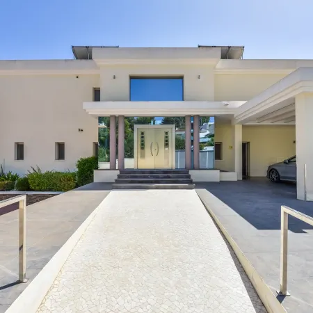 Large modern villa with indoor and outdoor pool sauna and bar.