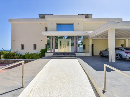 Large modern villa with indoor and outdoor pool sauna and bar.