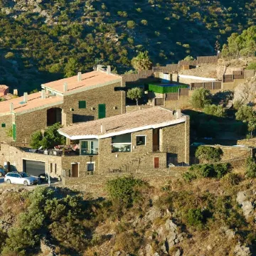 A charming family home with private pool in Cadaques with sea views.