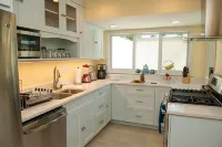 Beautifully newly renovated 3 BR/4 BA condo footsteps from the beach.