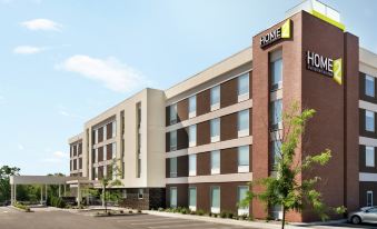 "a large brick building with a sign that reads "" home 2 suites by hilton "" prominently displayed on the side" at Home2 Suites by Hilton Middletown