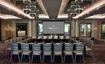 a conference room set up for a meeting , with rows of chairs arranged in a semicircle at Dalmeny Park House Hotel