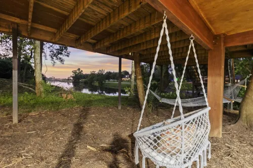 LUX Modern "Treehouse" on Private Lake - Gameroom, Kayaks, Bunkhouse, more!