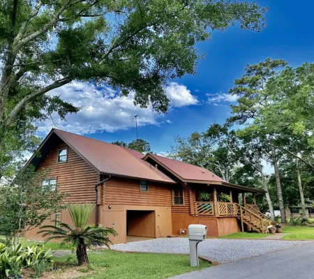 BEAUTIFUL WATERFRONT .  GNAT SCREENED BOATHOUSE AND AJOINING COVERED BOAT SLIPS