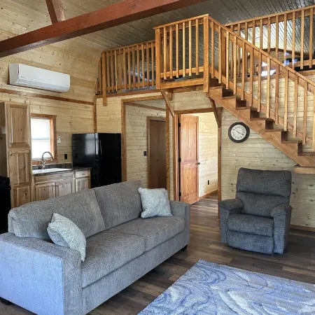 White cabin in the woods close to Univ. of Central Missouri and Whiteman AF Base