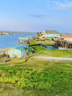 Beautiful beach house boasts a scenic water view from its front and back doors.