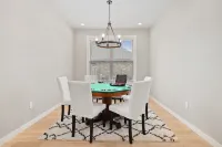 Outdoor Patio with TV and Fire Pit for Relaxation - Charming Oasis