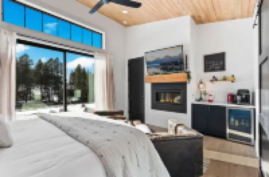 Soaking Tub and Cozy Fireplace - Inviting Rustic Retreat