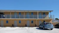 Stopforths Premium Accommodation Hotels near Hokitika Beach Sign