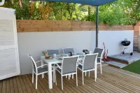 Charming outbuilding with large shaded terrace in private garden