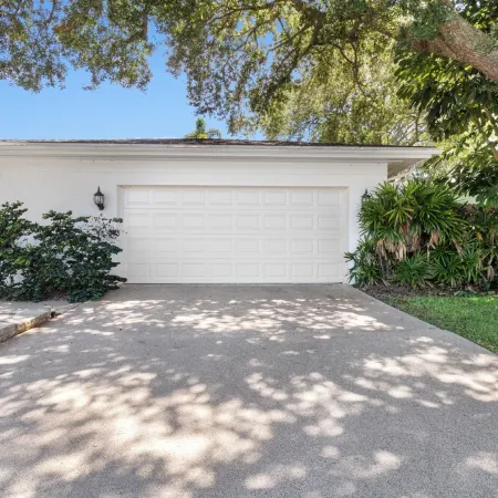 This beauty is centrally located,  with a heated pool and water fall!
