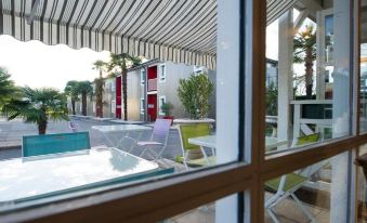 Brit Hotel Essentiel Pau Lescar - Housity