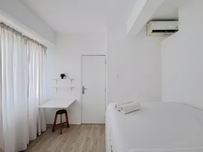 Compact and Restful 2BR at Menara Rungkut Apartment Hotel a Waru