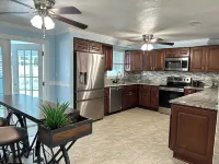 Quiet Pool Haven: 4BR - 9PPL, AC, WiFi, and Beaches Nearby