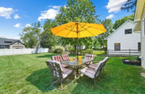 High-end home w/ fireplace, gourmet kitchen, sauna, game rm/ large yard/fire pit