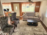 Open concept 2 bedroom ranch with attached garage and deck