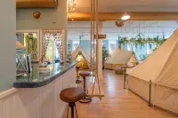 Experience Stay at the Glamping Loft Lake Geneva |Group Stays |12 Stylish Tent Suites |Kitchen & Bar Hotels in Lake Geneva
