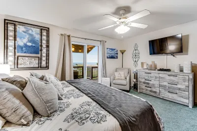 Spacious coastal home with private hot tub, ocean view, wood stove & EV charging