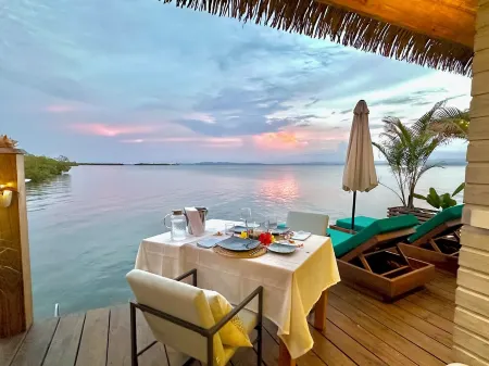 Ocean Light Over Water Bungalow, Bedroom, King Bed, Living Room, Kitchenette