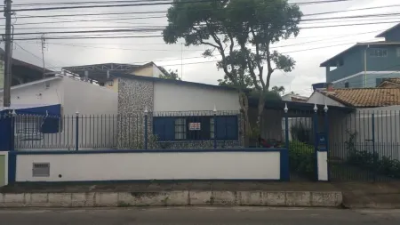 home Beach Center, wooded and grassy yard with fruit trees.